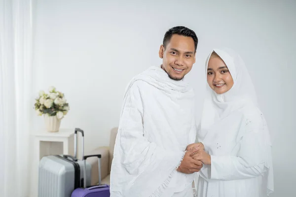 muslim pilgrims wife and husband ready for Hajj