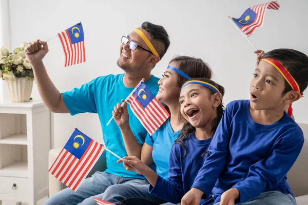 excited malaysian sport fans supporter