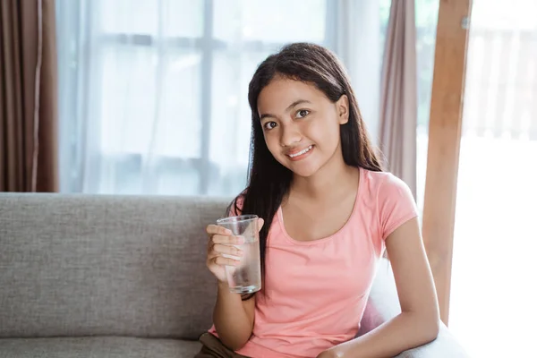 Teen girl having a glass of water — Stock Photo, Image