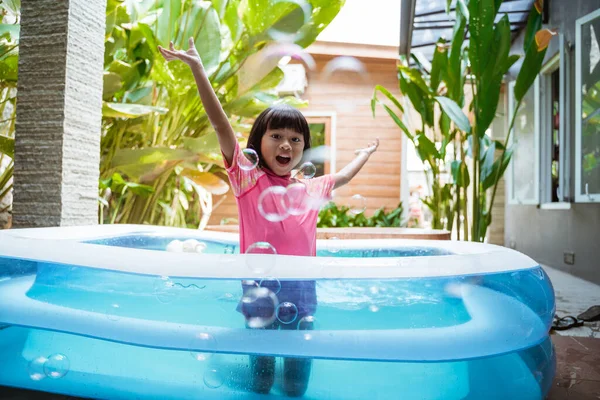 Kid swim in inftable pool — Stock Photo, Image
