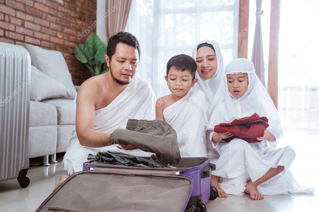 muslim family packing for umrah and hajj