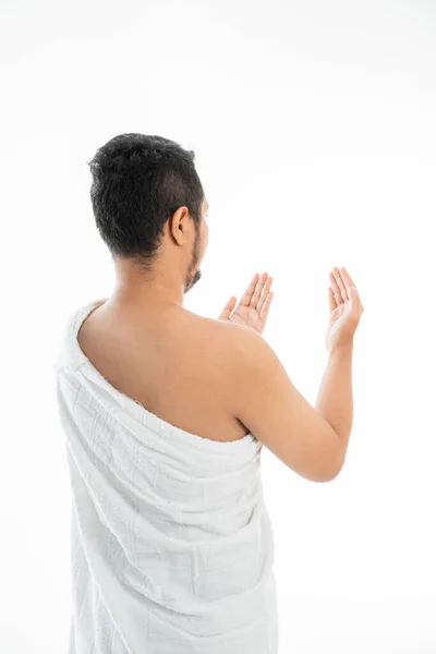 Muslim man praying in white traditional clothes — Stock Photo, Image