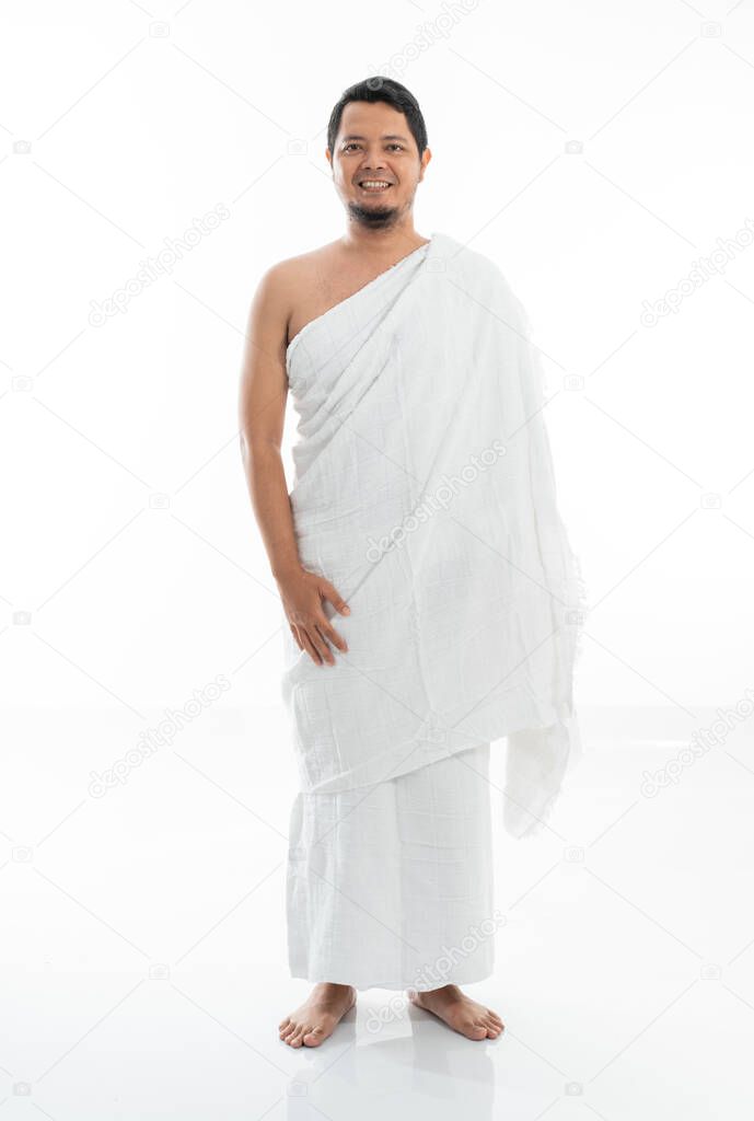 pose muslim asian man standing with tasbih
