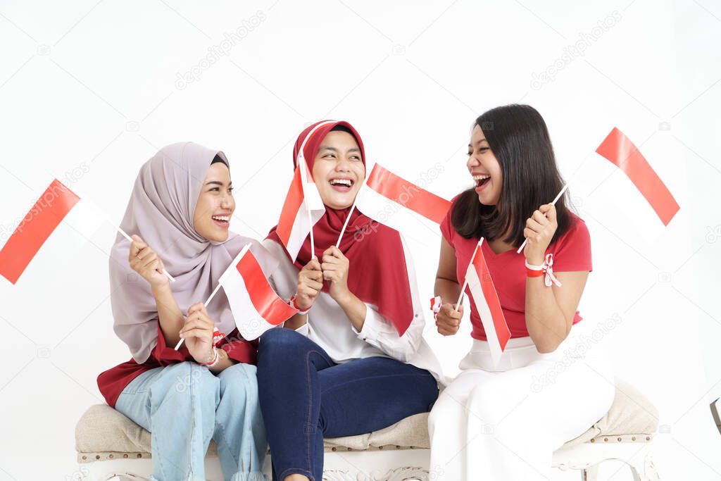 happy indonesian woman with flag celebrating independence day