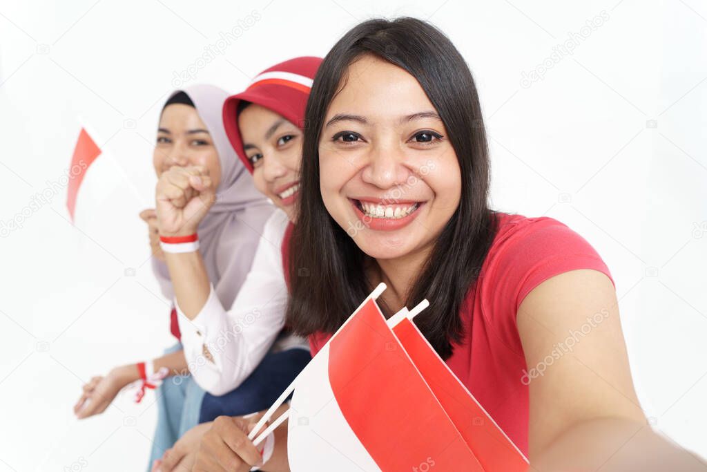 woman taking selfie while celebrating indonesian independence day