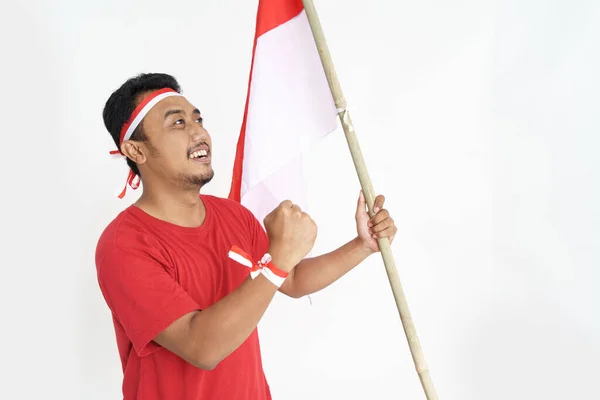 Macho excitado sosteniendo bandera indonesia —  Fotos de Stock