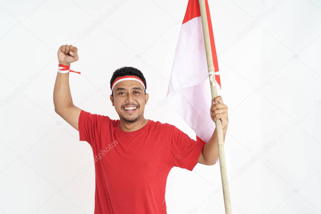 excited male holding indonesian flag