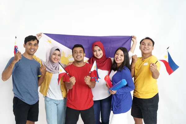 Excited asian young supporter holding philippine flag — Stock Photo, Image