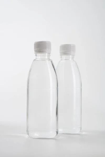 Liquid product on blank plastic container bottle — Stock Photo, Image