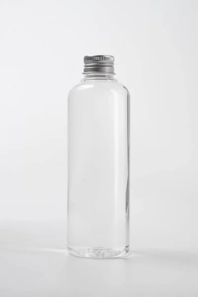 Liquid product on blank plastic container bottle — Stock Photo, Image