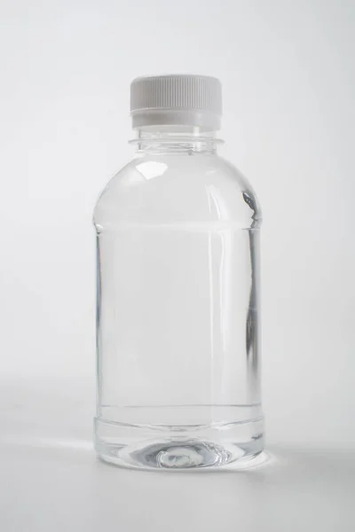 Liquid product on blank plastic container bottle — Stock Photo, Image