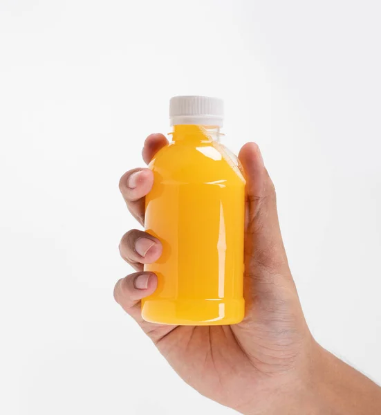 Hand holding beverage product on plastic bottle mockup — Stock Photo, Image