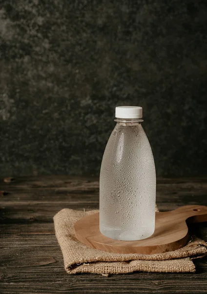 Liquid product on blank plastic container bottle — Stock Photo, Image