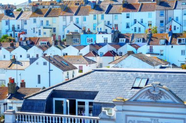 Rows of English white terraced houses close together on top of e