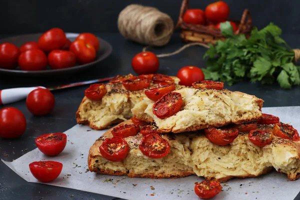Pieces Focaccia Cherry Tomatoes Located Close Parchment Dark Background — Stock Photo, Image