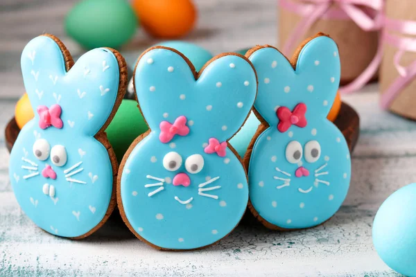 Easter funny rabbits, homemade painted gingerbread biscuits in glaze