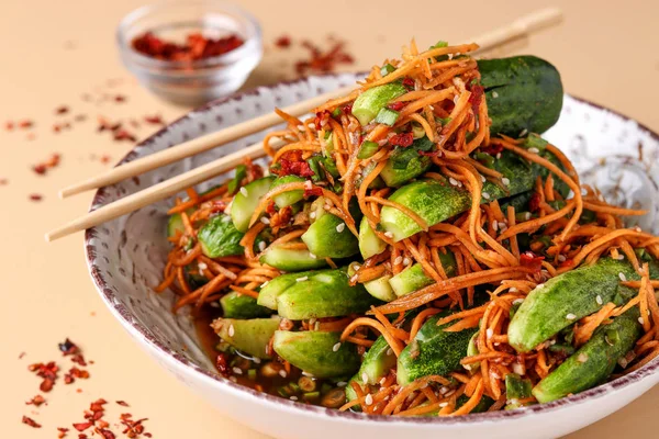 Traditional Korean cucumber kimchi snack: cucumbers stuffed with carrots, green onions, garlic and sesame, fermented vegetables, horizontal orientation — Stock Image Traditional Korean cucumber kimchi snack: cucumbers stuffed with carrots, green onions, garlic and sesame, fermented vegetables, horizontal orientation Stock Photo