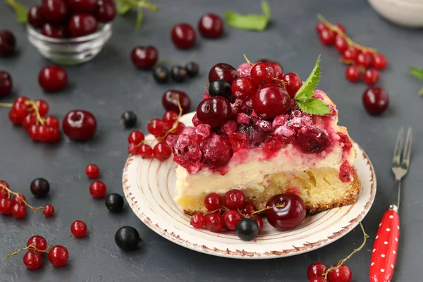 Piece summer cottage cheese cake with berries on a dark background, horizontal format