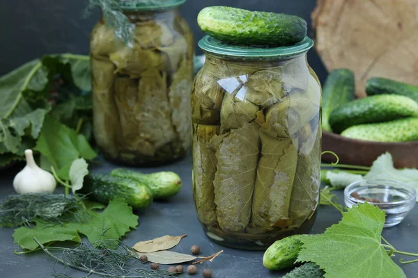 Marinated Cucumbers Grape Leaves Garlic Dill Two Glass Jars Dark — Stock Photo, Image