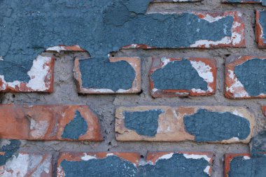 Kırık mavi boya kopyalama alanı olan eski tuğla duvar tasarım veya metin için, yatay yönelim