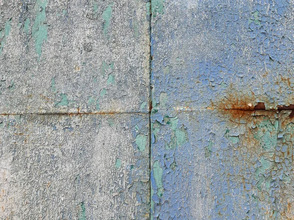 Texture of old rusty iron, painted with deep paint. Joint of four sheets of iron with old paint.