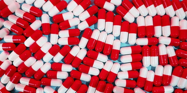 Muchas píldoras o medicamentos de color rojo-blanco — Foto de Stock