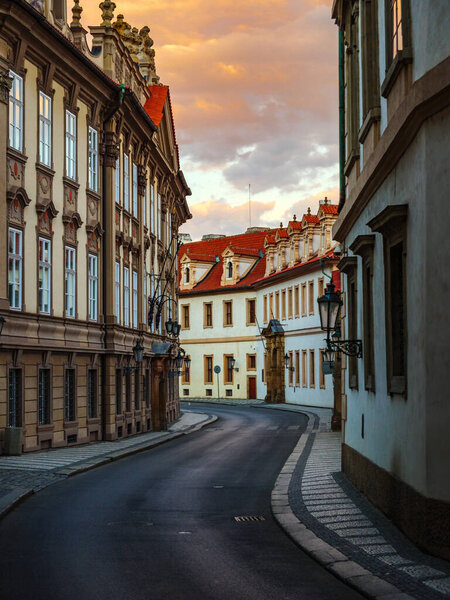 Dramatic sunset on an empty historic street in Prague