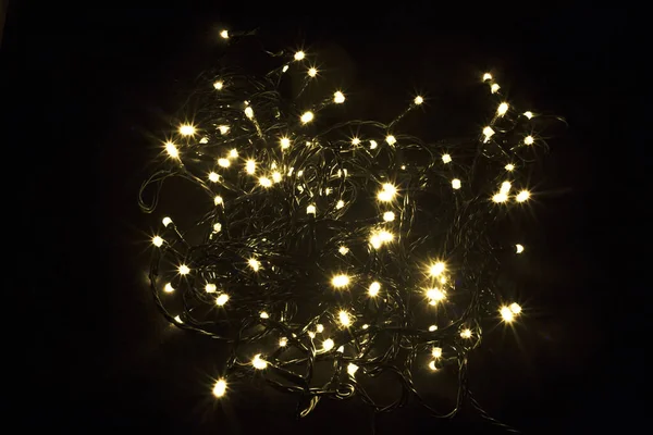 Christmas garland background. Led Christmas lights. Isolated on a black background.