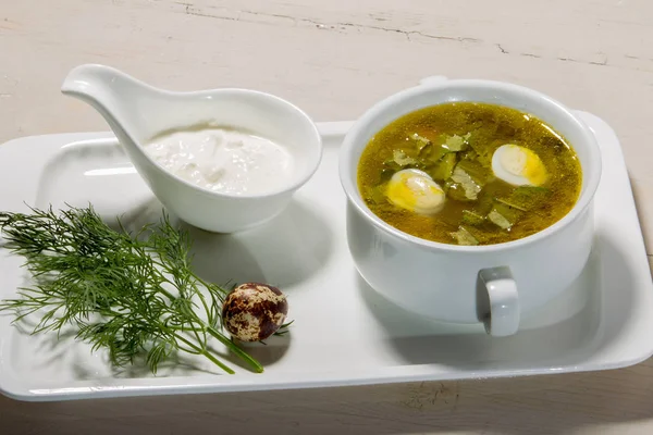 Soup with sorrel and quail egg — Stock Photo, Image