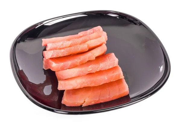 Raw salmon sushi meat cubes isolated on a white background