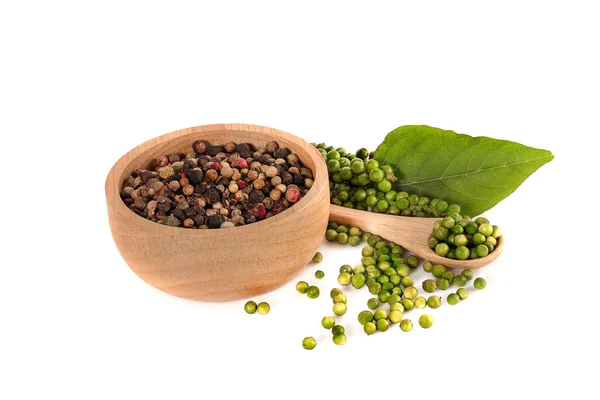 Fresh green peppercorns and black peppercorns isolated on white background