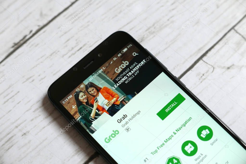 KULIM,MALAYSIA - APRIL 11TH,2018 : Grab application on android Google Play Store. Grab is a Singapore-based technology company that offers ride-hailing and logistics services.