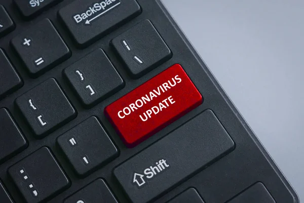 A black keyboard with red button written with Coronavirus Update as per current situation of Covid-19 pandemic virus outbreak.