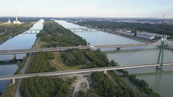 Aerial view of modern Vienna city . Flying over danube bridge with crossing traffic — Stock Video