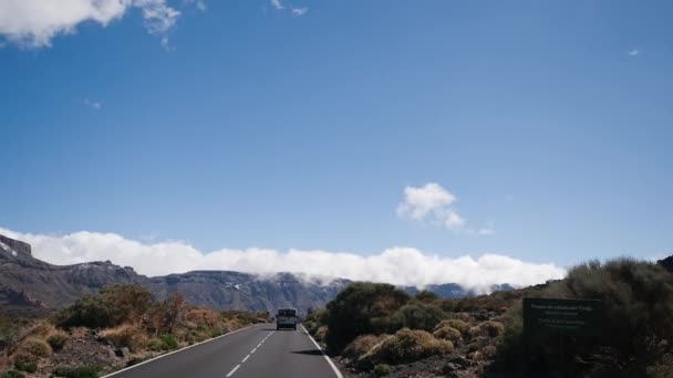 stock video View from a car moving through Teide National Park, Tenerife, Canary Islands, Spain. Volcanic rocky desert landscape