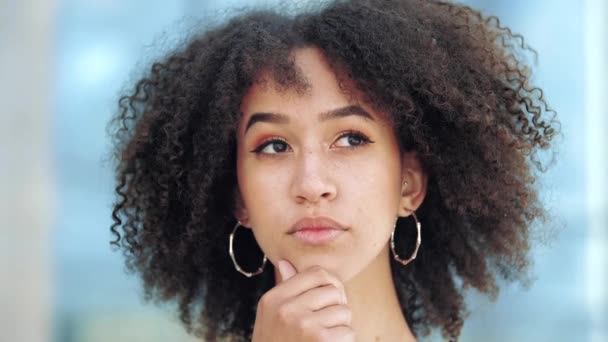 Young pensive afro american girl meditating thoughtfully at idea hold hand to chin, finger against cheekbone, with gesture of thought about problem solution with puzzled facial expression on street — Stock Video