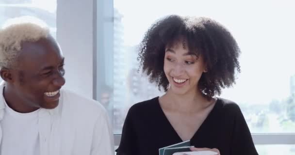 Young attractive African guy and ethnic curly cute girl standing, talking actively, laughing friendly with joke, holding passports and tickets in hands, communicating flirting, love couple concept — Stock Video