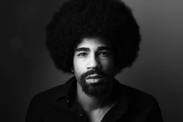 Black man portrait on black and white thone