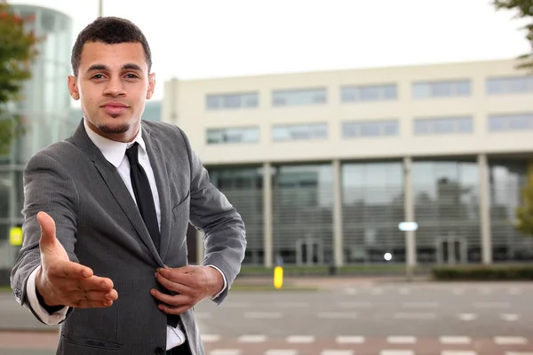 Black businessman is giving hand to handshake