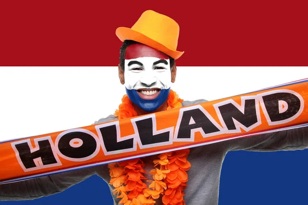 Black sport fan with Holland scarf on Netherlands flag background