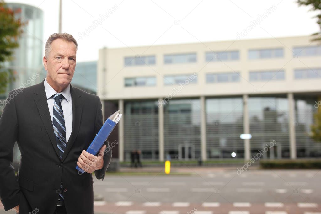 Caucasian old businessman with documents