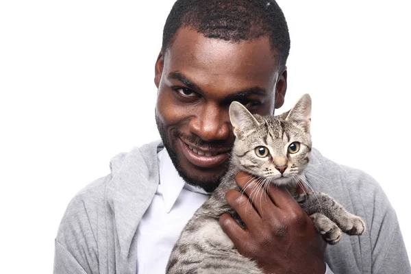 Black man holding cat