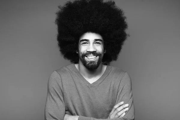 Afro-american man with curly hair in black and white thone