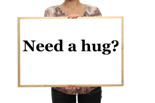 Γυναίκα Κρατά Μαυροπίνακα Λέξη Χρειάζομαι Μια Αγκαλιά — Φωτογραφία Αρχείου