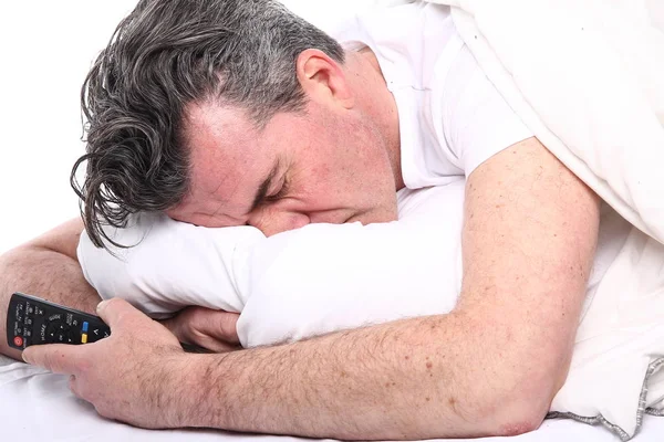 Old caucasian man sleeping in bed