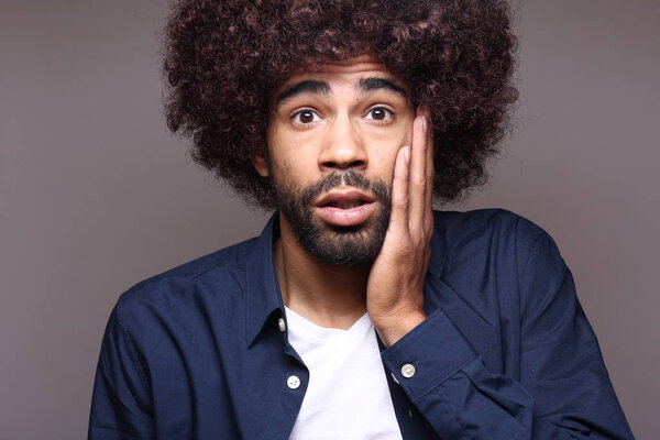 Surprised black man with big hair