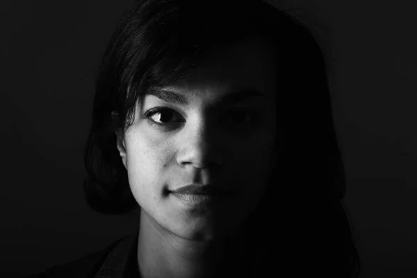 Beautiful afro-american woman is serious on black and white tone