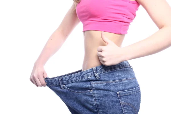 Caucasian Slim Girl Posing Big Jeans Showing Thumbs — Stock Photo, Image