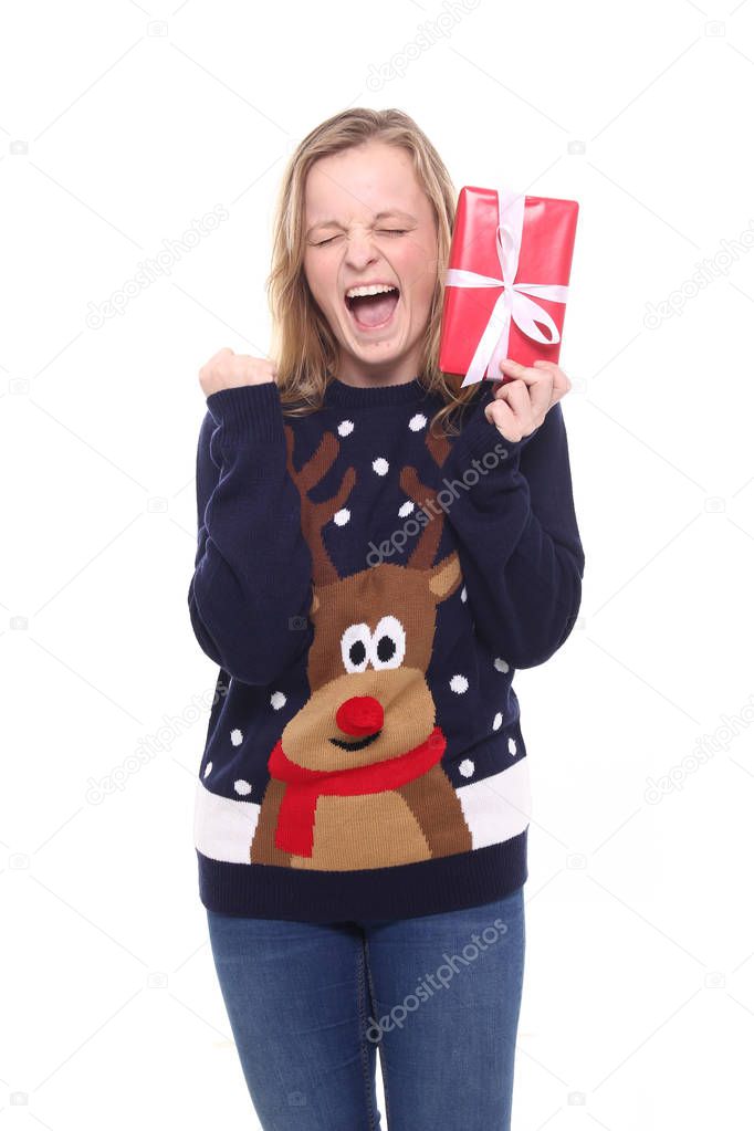 Beautiful girl with holiday gift