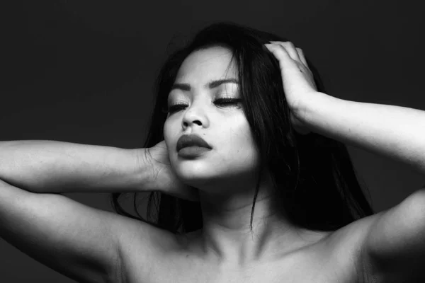 Sexual young woman on black and white tone